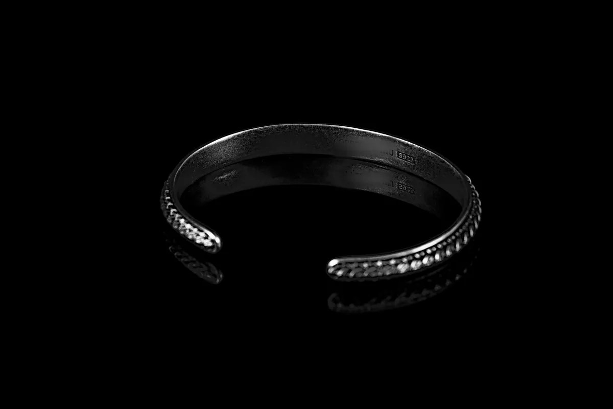Hoovu cuff in the oxidised finish, darker in the petal pattern