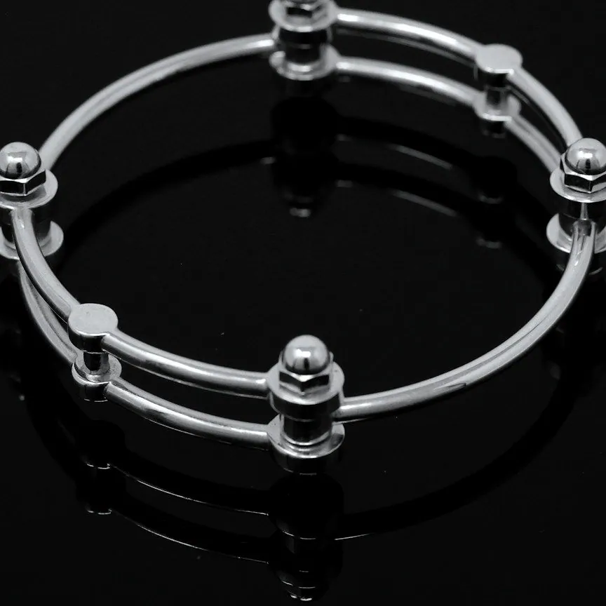 Close view of the twin rods and round silver beads of the bangle